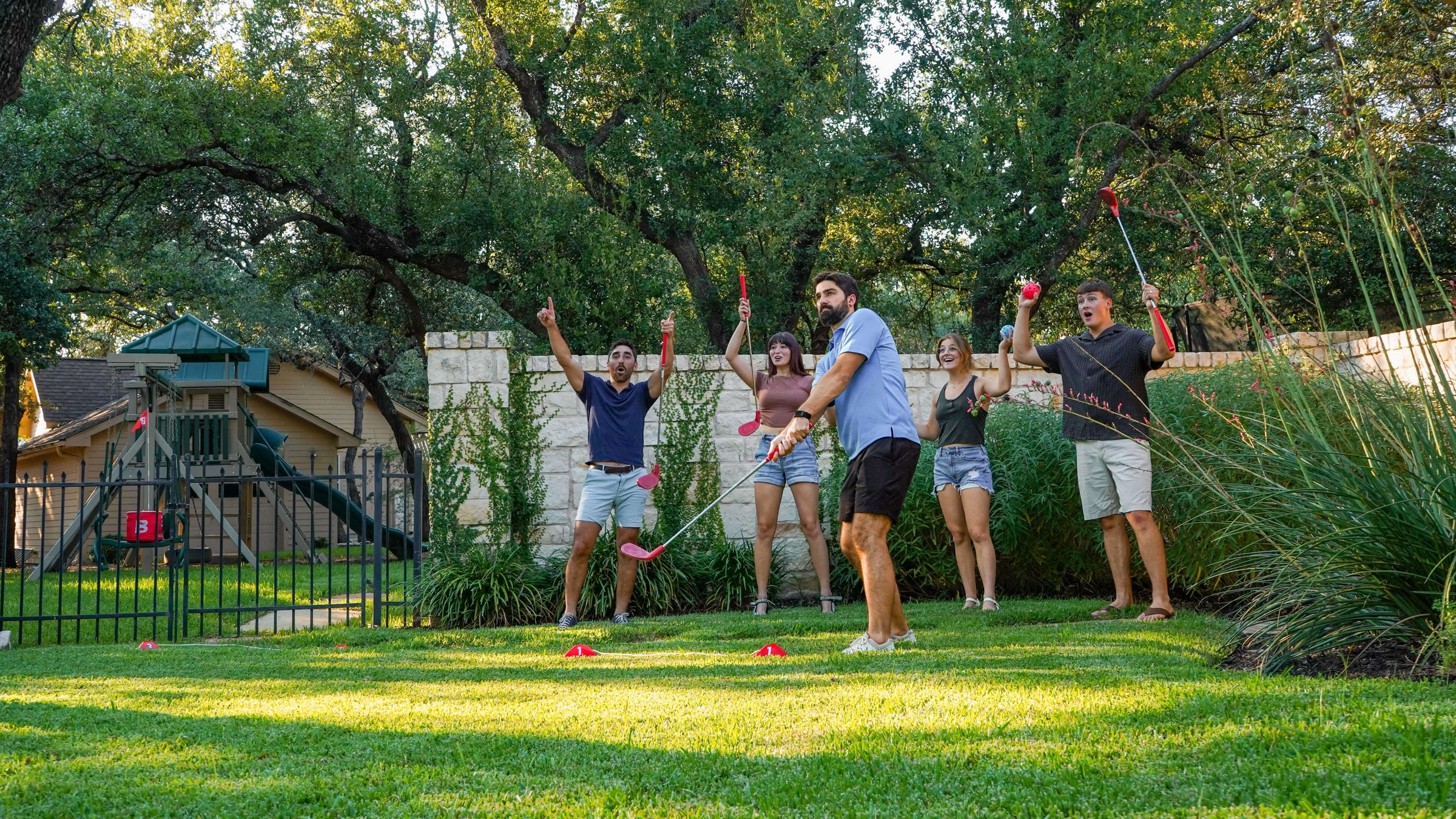 Friends playing BucketGolf outdoors